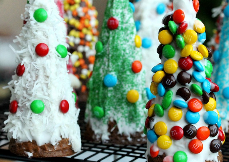 Decorate upside-down waffle cones to make Christmas tree desserts