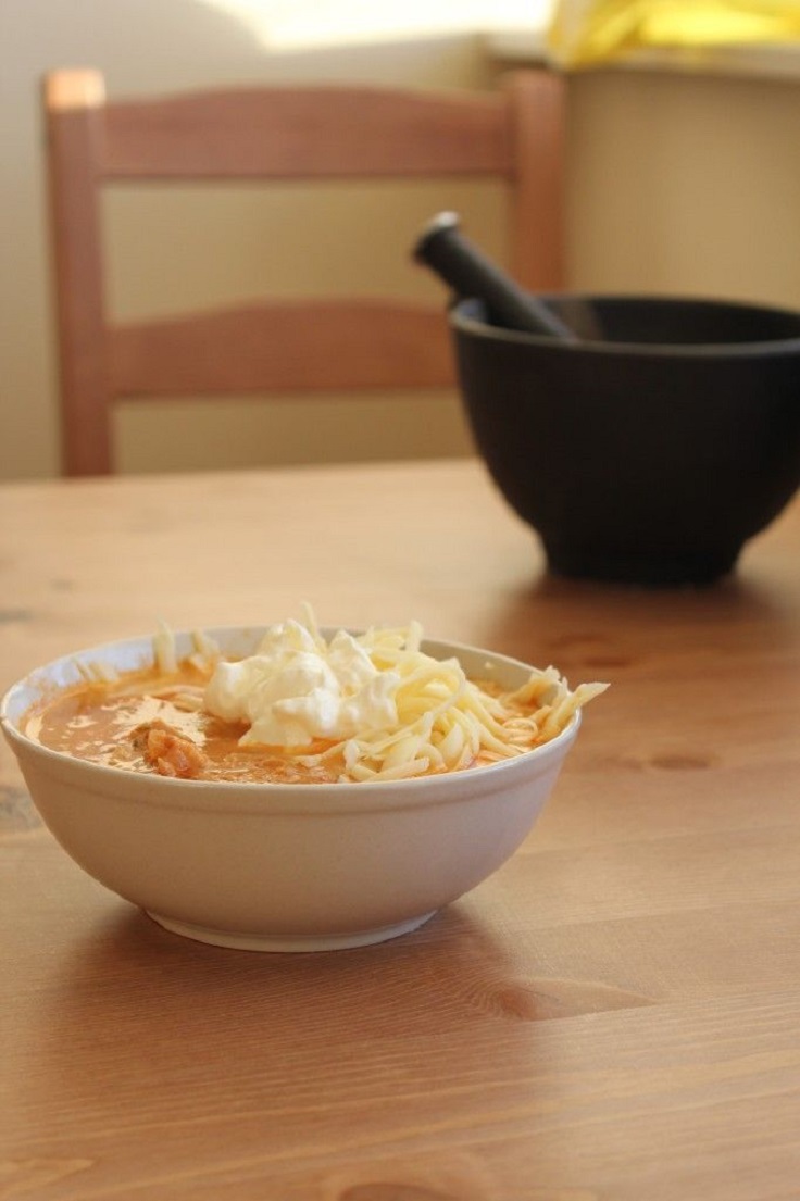 Mexican Chicken Soup Loaded with Sour Cream and Shredded Cheese recipe