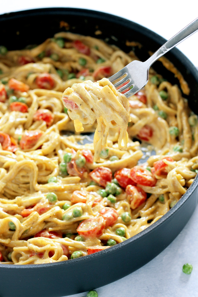25 Delicious Vegan Dinner Recipes That Anyone Can Make - One Pot Vegan Fettuccine Alfredo with Peas and Roasted Cherry Tomatoes Recipe